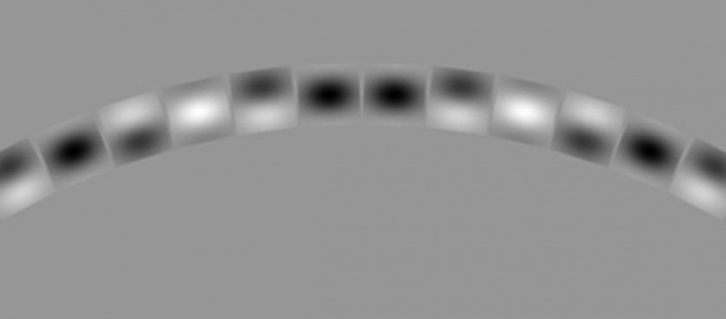Een close-up van een deel van de cirkel laat zien hoe de Gabor-patches de vorm van de algehele structuur vervormen.