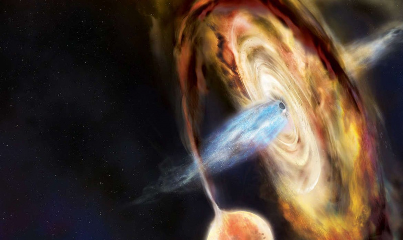 Kunstwerk van een zwart gat terwijl het een ster uit elkaar scheurt, een wervelende accretieschijf van materiaal eromheen creëert en enorme bundels materie uitblaast die door zijn magnetische veld worden opgewonden. Krediet: Aurore Simonnet en NASA's Goddard Space Flight Center