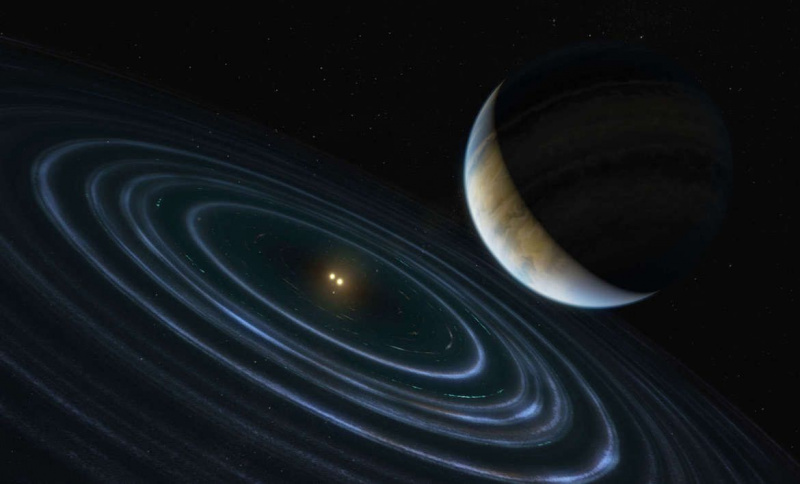 Kunstwerk, das den Super-Jupiter-Exoplaneten HD 106906 b zeigt, der über 100 Milliarden km um seinen Doppelsternwirt kreist. Eine Scheibe aus planetenbildendem Material umgibt die Sterne und weist auf ihr junges Alter hin. Quelle: ESA/Hubble, M. Kornmesser