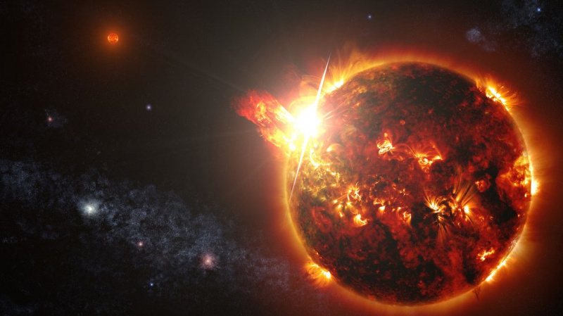 フレアを受けている連星系の赤色矮星のアートワーク。クレジット：NASA