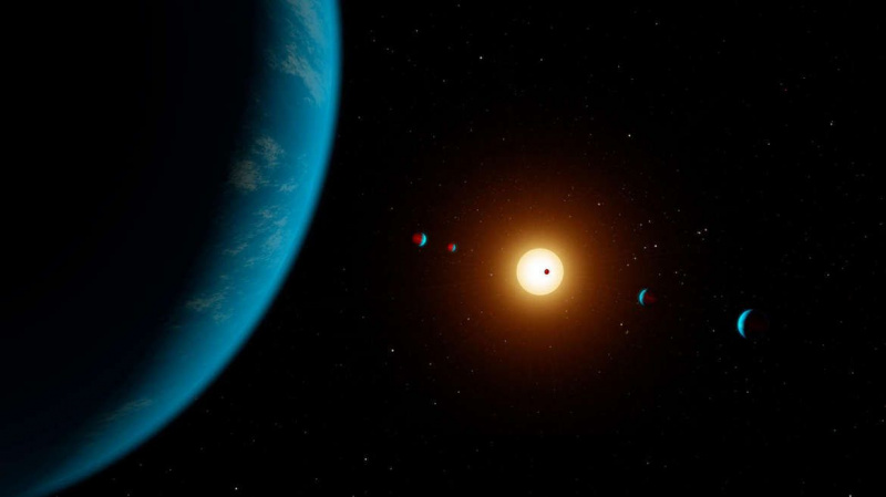 Kunstverk som viser en stjerne med flere planeter som kretser rundt den. Kreditt: NASA/JPL-Caltech/R. Hurt (IPAC)